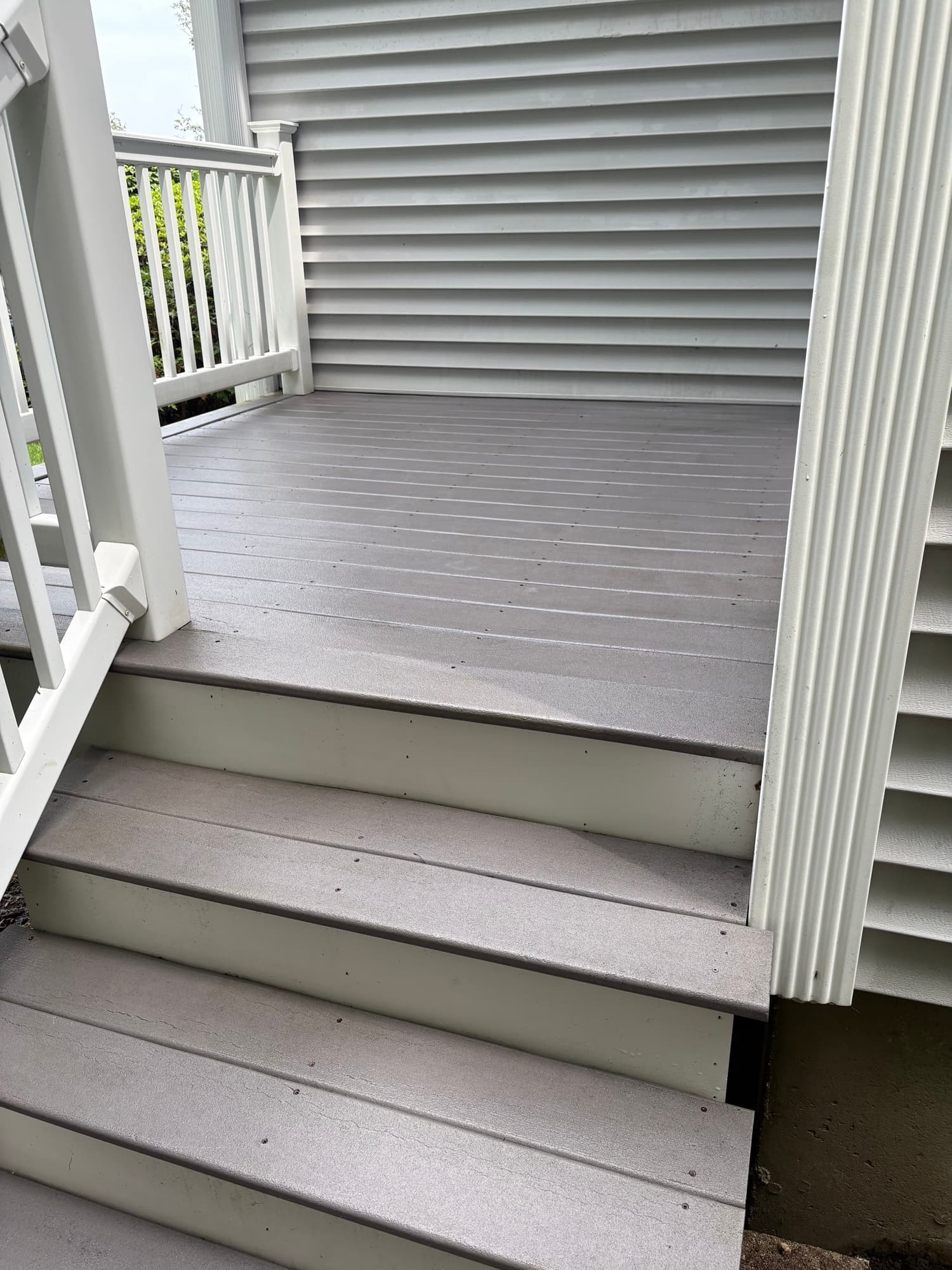 Composite deck and stairs with white railings